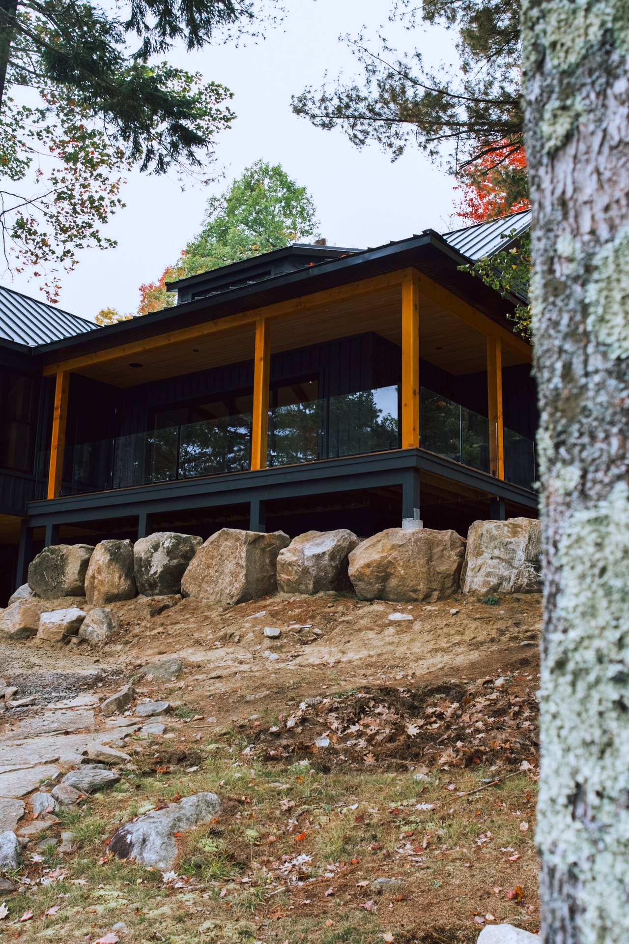 Bigwin Island cottage exterior with screened porch above granite