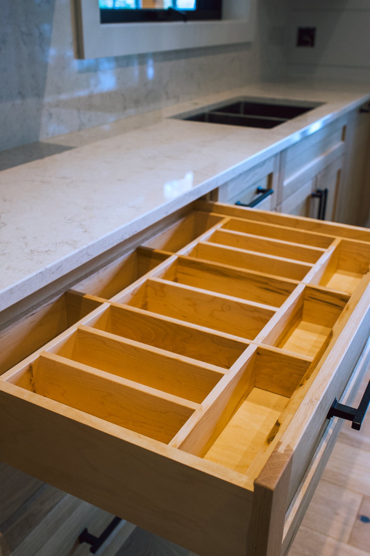 Custom solid oak cutlery drawer dividers in a Bigwin Island kitchen